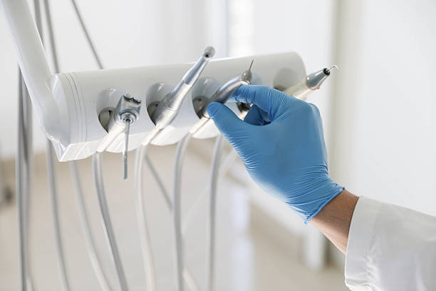 Professional Tooth Extraction technician working in Cumming, GA